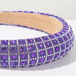 Detail of wide headband with purple and silver rhinestones on a khaki suede lining