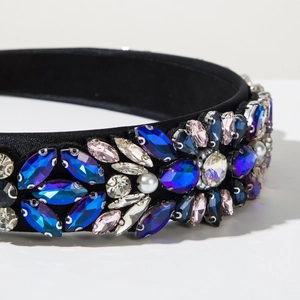 Detailed close-up of Baroque style wide headband with multi-color crystals and white pearls