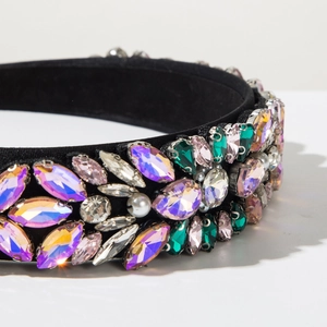 Detailed close-up of luxurious baroque headband with colorful crystals and pearls
