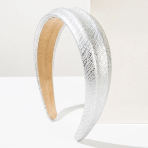 Detail of silver faux snake skin headband with thick foam and khaki suede lining
