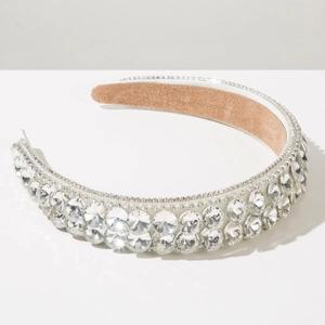 Macro shot of Baroque white headband with large sparkling rhinestones and plush lining