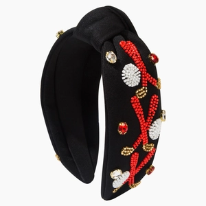 Black knotted headband with handmade seed beads and rhinestones in golf ball pattern