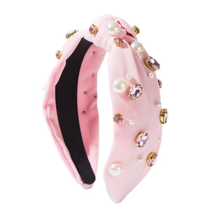 Serre-tête noué rose avec perles blanches et gemmes sur large bande en tissu