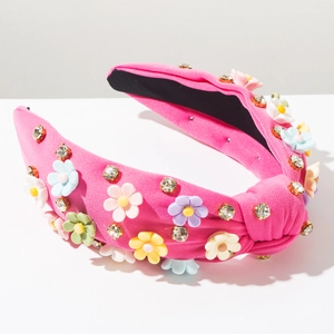 Detail of pink knotted wide headband with 3D colorful flowers and crystal rhinestones