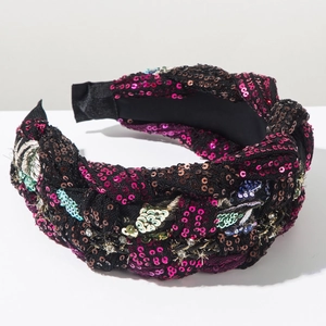 Detailed embroidery with colorful sequins and rhinestones on bohemian braided headband