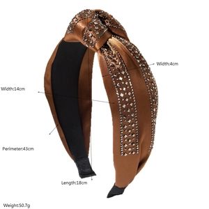 Detail view of brown satin headband with sparkling rows of silver square rhinestones