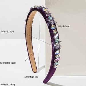 Detail view of purple velvet headband with crystal rhinestones and mesh bow accents
