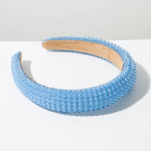 Close-up of light blue beaded headband with sponge padding and velvet lining detail