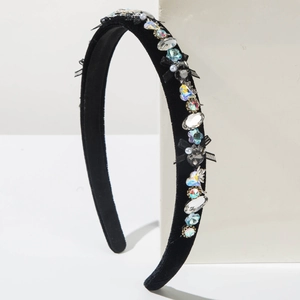 Detail of velvet headband featuring sparkling crystal rhinestones and small black bows