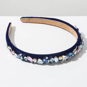 Detail of luxury navy velvet headband featuring colorful rhinestones and crystal beads