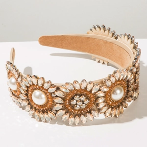 Detailed macro view of baroque headband with amber crystals and large pearls