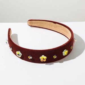 Detailed close-up of Baroque velvet headband with crystal floral patterns and rhinestones