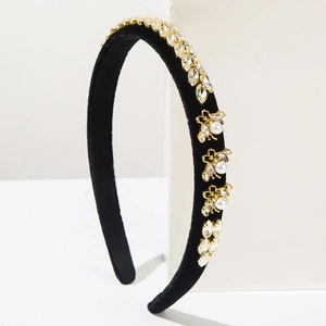 Detail of baroque black velvet headband with gold bees and sparkling crystals