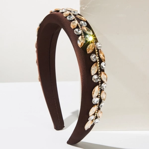 Detailed close-up of Baroque padded headband with champagne crystal leaf embroidery