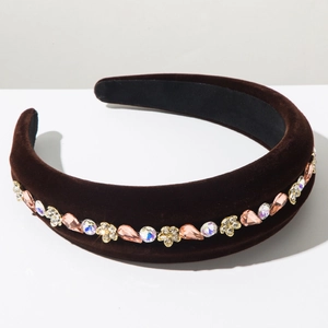 Detail of coffee velvet headband with sparkling rhinestones and floral crystal accents