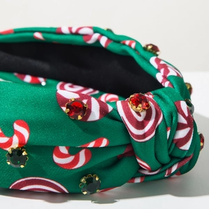 Détail du serre-tête de Noël vert avec motifs de canne à sucre et strass étincelants