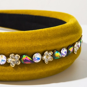 Detail shot of vintage velvet padded headband with colorful rhinestone floral embellishments