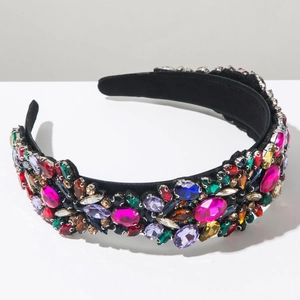 Close-up of colorful crystal rhinestones hand-set on a luxury wide velvet headband