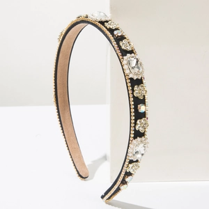 Macro detail of Baroque black headband with intricate floral crystals and sparkling rhinestones