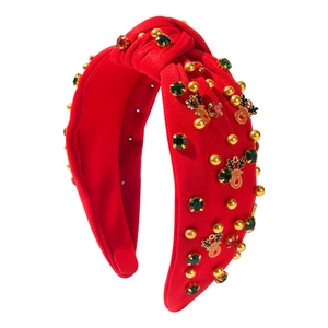 Red knotted Christmas headband with festive rhinestones and gold reindeer charms