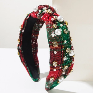 Detail of Christmas headband with red and green plaid fabric, pearls and rhinestones