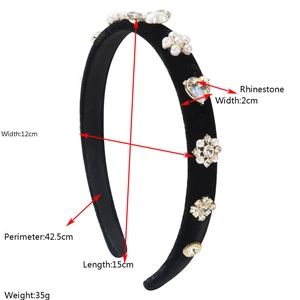 Elegant baroque velvet headband with pearls and rhinestones on a white background
