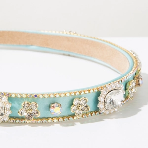 Detailed close-up of Baroque headband with light blue satin and sparkling crystal rhinestones