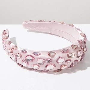Detail of pink satin headband with hand-sewn rhinestones and crystals for party wear