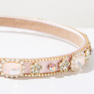 Close-up of pink baroque headband with luxury rhinestones and pearl floral details