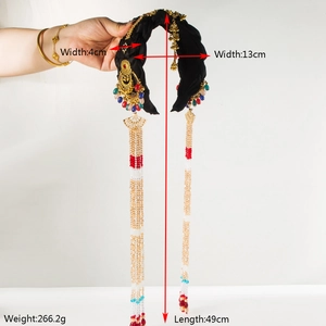 Close-up of ethnic style headband showing colorful beads and long tassel pendants