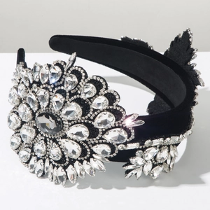 Close-up of Baroque flower headband with luxury crystals on a black velvet base