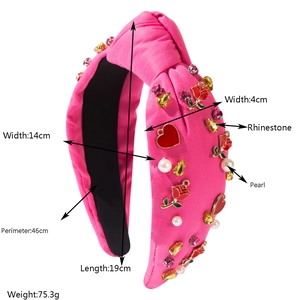 Detail view of pink knot headband showing dimensions, rhinestones, and pearls