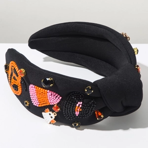 Detailed view of Halloween headband with beaded pumpkin and ghost crystal embellishments