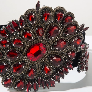 Close-up of Baroque headband featuring deep red crystals and teardrop gemstones