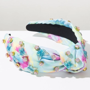 Detail von Batik-Stoff-Stirnband mit rosa Kristallen und blauen Schmetterlingsmotiven