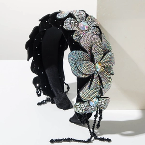 Detail of velvet wide headband with 3D rhinestone flowers and beaded tassels