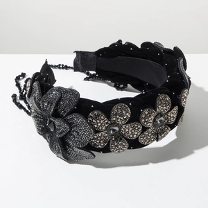 Detail of velvet braided headband with 3D rhinestones flowers and black beaded tassels