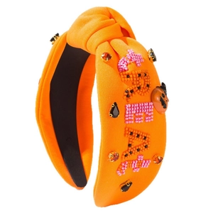 Halloween knotted headband with TREAT beads, rhinestones and pumpkin charms on orange fabric