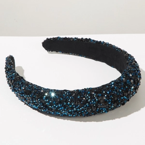 Detail of wide padded headband with deep blue rhinestones and non-slip velvet lining