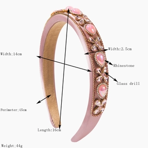 Baroque pink fabric headband with luxurious rhinestones and crystals on white background