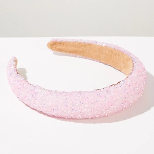 Detailed view of pink sparkling padded headband with rhinestones and non-slip lining