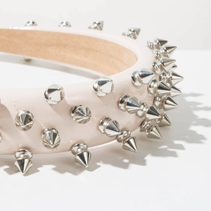 Close-up of pink leather headband with silver cone studs and anti-slip lining