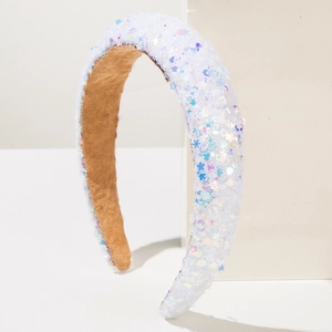 Detail view of thickened white sequin headband with colorful star and heart patterns