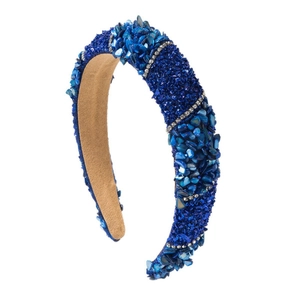 Fashionable wide headband with blue crushed stones and sparkling rhinestones on khaki lining
