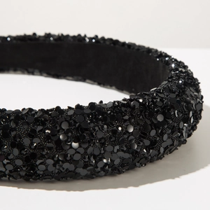 Close-up of black wide headband with sparkling sequins and anti-slip flocking lining