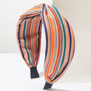 Cerchietto bohémien in tessuto a righe colorate con nodo superiore e fascia larga