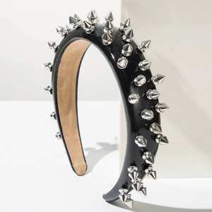 Fashionable black leather headband featuring silver metal cone spikes in punk rock style