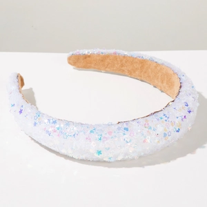 Detail of sponge headband featuring colorful star sequins and brown non-slip velvet lining