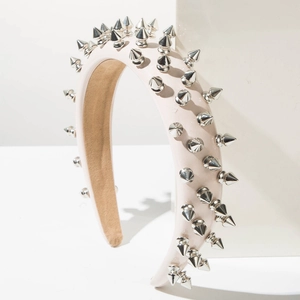 Punk style light pink leather headband with silver metal spikes and khaki velvet lining