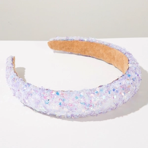 Close-up of a light purple sequined headband featuring star glitter and soft velvet lining